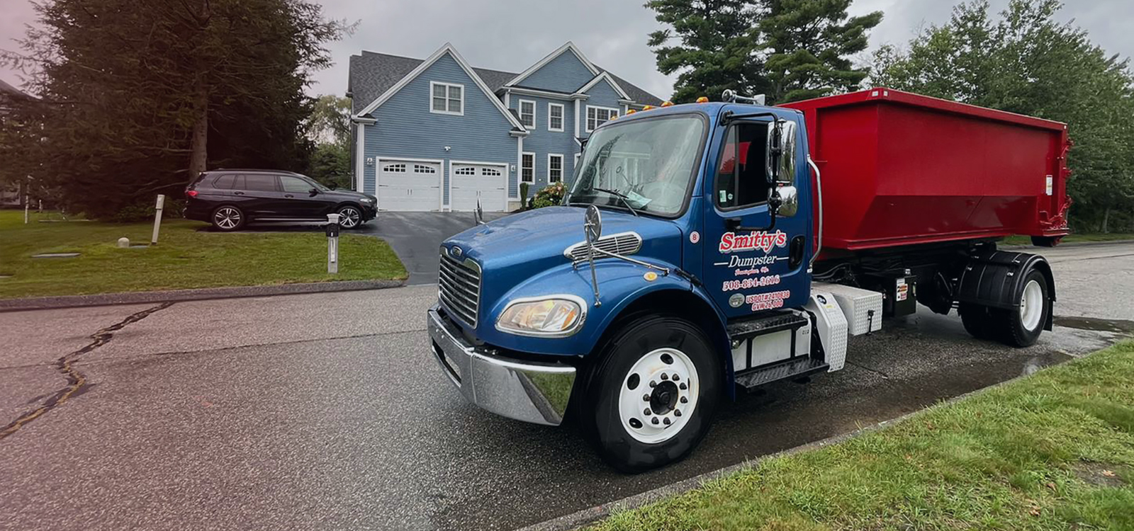 Dumpster rental in driveway